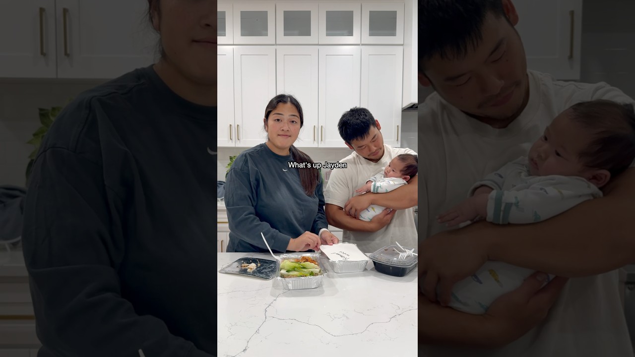 Zach & Tee in the kitchen with their newborn